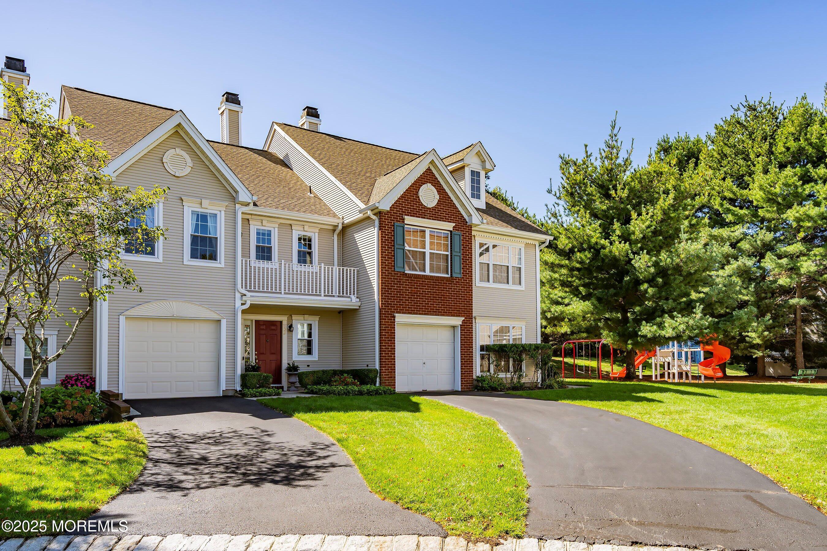 32 Bristel Road, Unit 212 Holmdel, NJ 07733 - Photo 5 of 61 a front view of a house with a yard