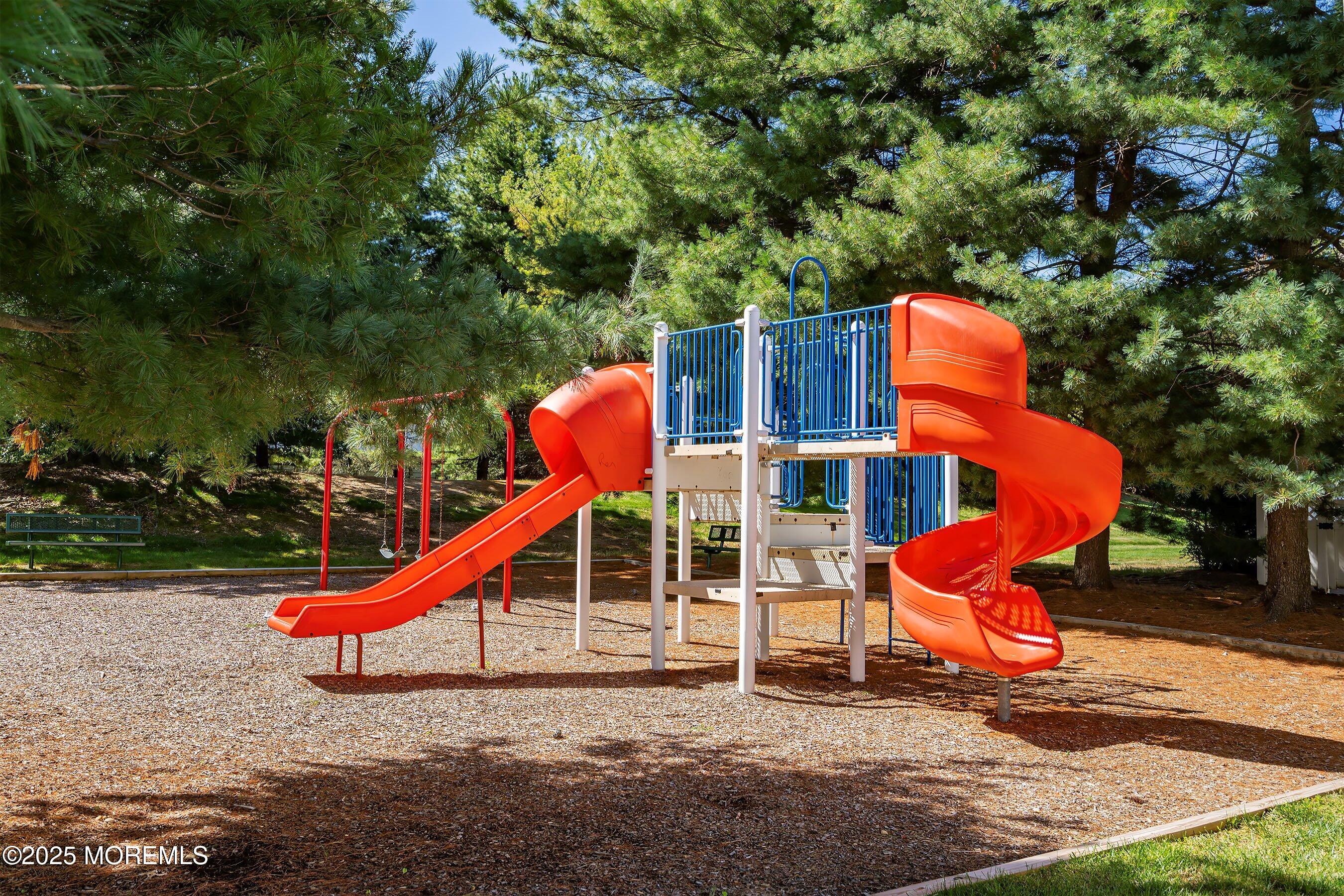 32 Bristel Road, Unit 212 Holmdel, NJ 07733 - Photo 54 of 61 a wooden bench sitting in front of a building