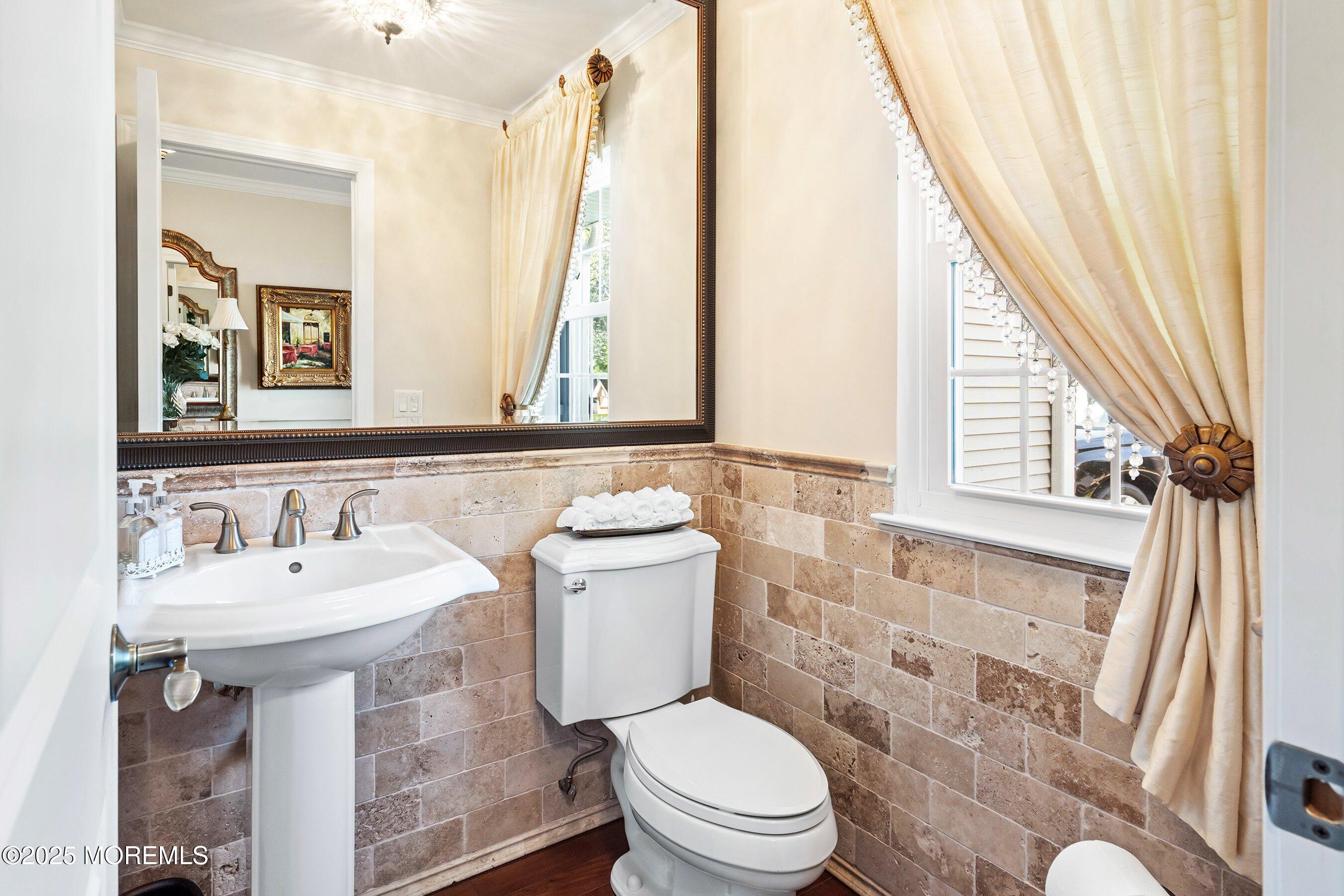 32 Bristel Road, Unit 212 Holmdel, NJ 07733 - Photo 8 of 61 a bathroom with a sink a mirror a toilet and a window