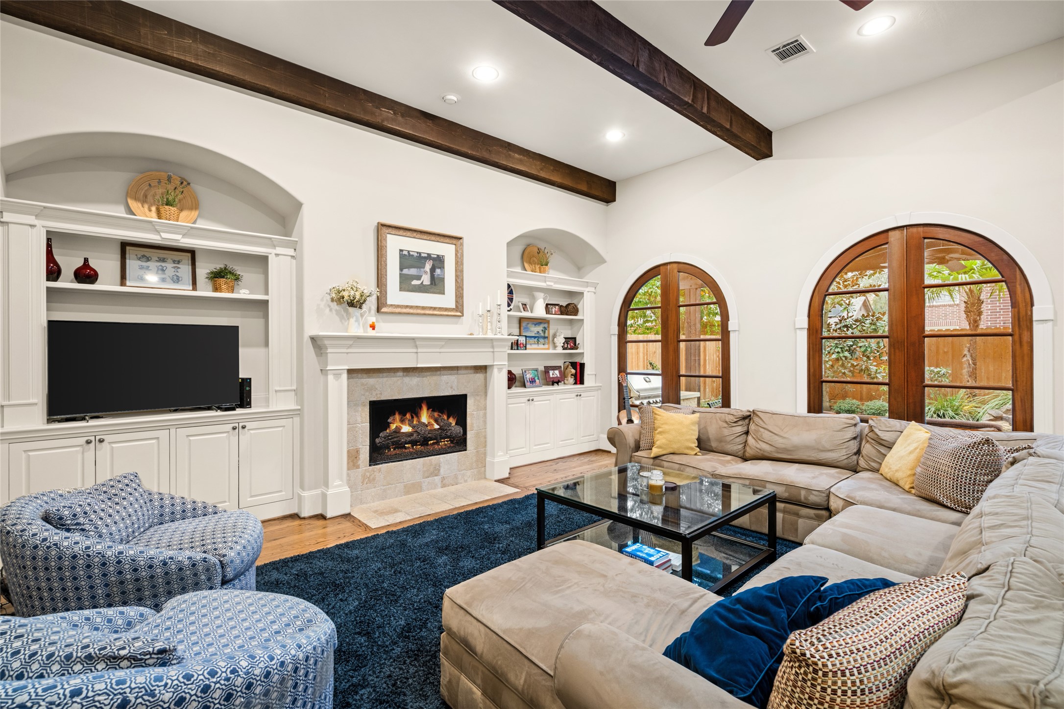4219 Oberlin Street Houston, TX 77005 - Photo 11 of 33 The spacious family room features built in cabinetry and arched windows/doors.