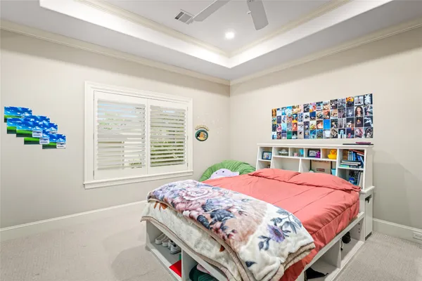 a bedroom with bed and a window