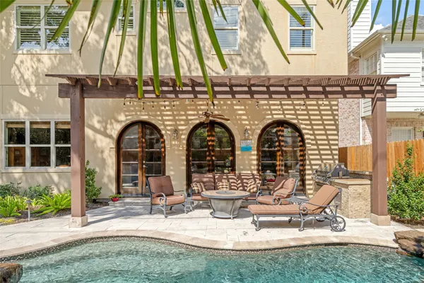 a front view of a house with outdoor seating