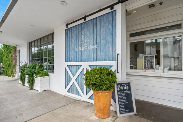 front view of a house with potted plants
