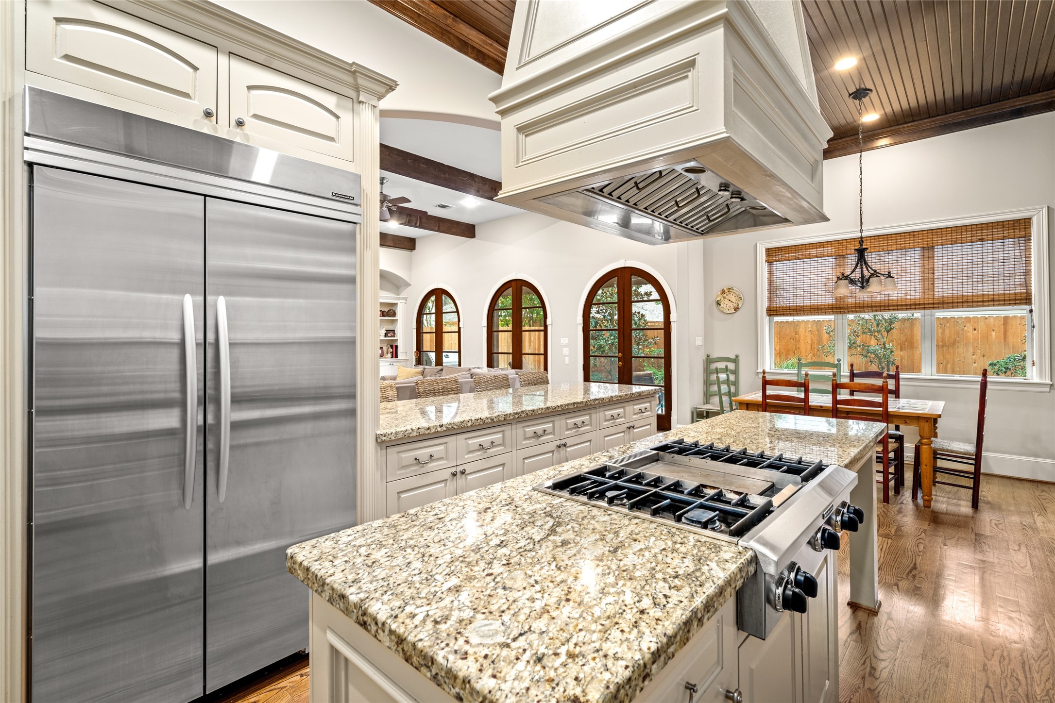 4219 Oberlin Street Houston, TX 77005 - Photo 8 of 33 The chef's kitchen features a central island, generous storage and stunning ceiling detail.