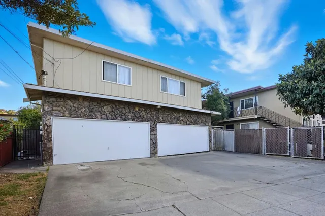 a front view of a house with a garage