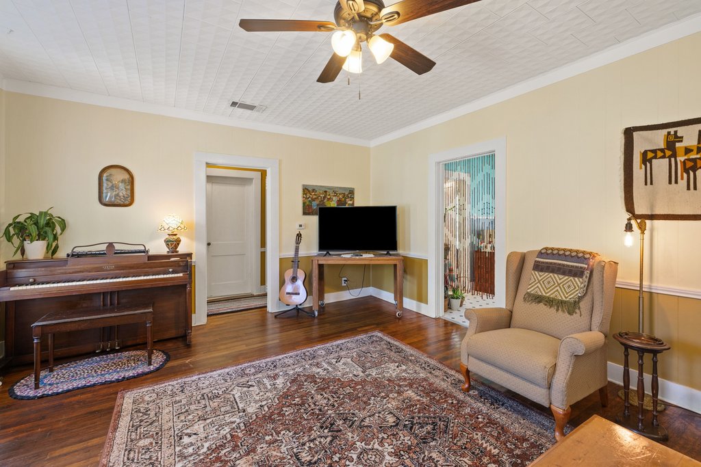 807 Cecelia Street Taylor, TX 76574 - Photo 7 of 24 a living room with furniture and a flat screen tv
