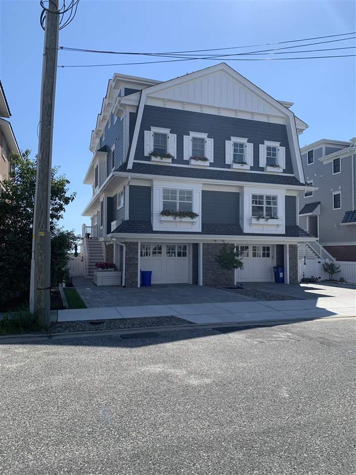 a view of a house with a street
