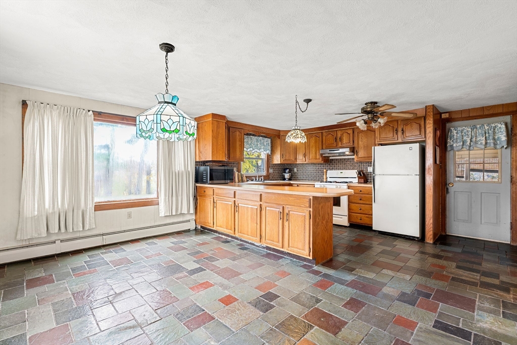 36 Smith Road Hingham, MA 02043 - Photo 11 of 35 a kitchen with refrigerator and cabinets