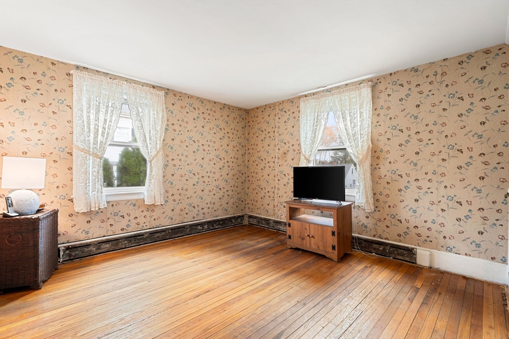 36 Smith Road Hingham, MA 02043 - Photo 15 of 35 a view of a room with wooden floor and window