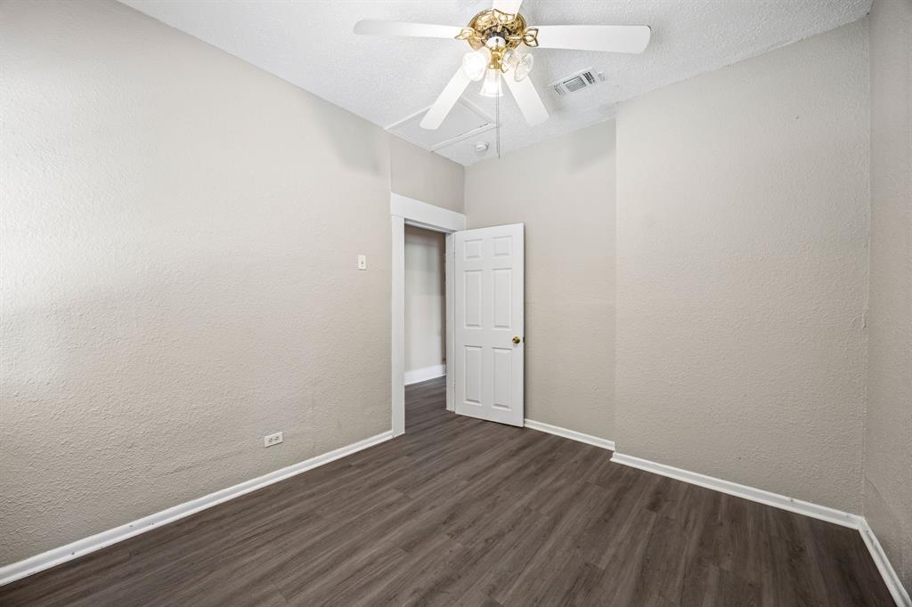 705 Madison Street Cleburne, TX 76033 - Photo 17 of 26 wooden floor in an empty room
