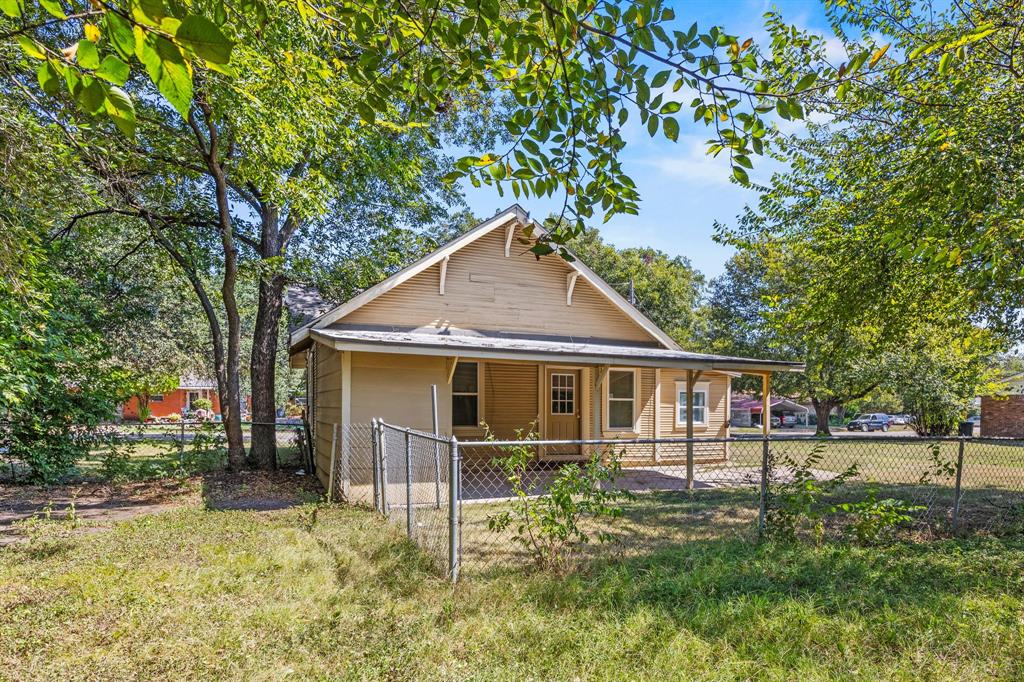 705 Madison Street Cleburne, TX 76033 - Photo 26 of 26 front view of house with a yard