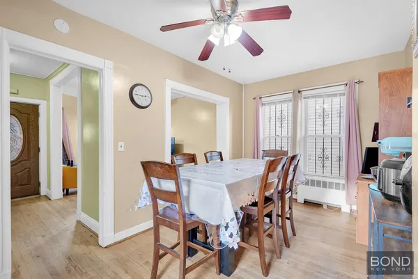 a view of a dining room with furniture and a chandelier