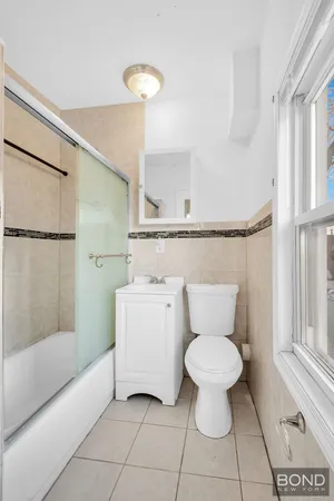 a bathroom with a toilet sink and bathtub