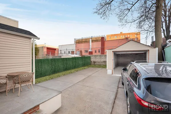 a view of a porch with a fireplace and a chair
