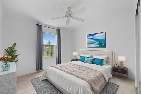 a bedroom with a bed and a window