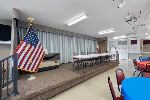 a bedroom with furniture and a chair