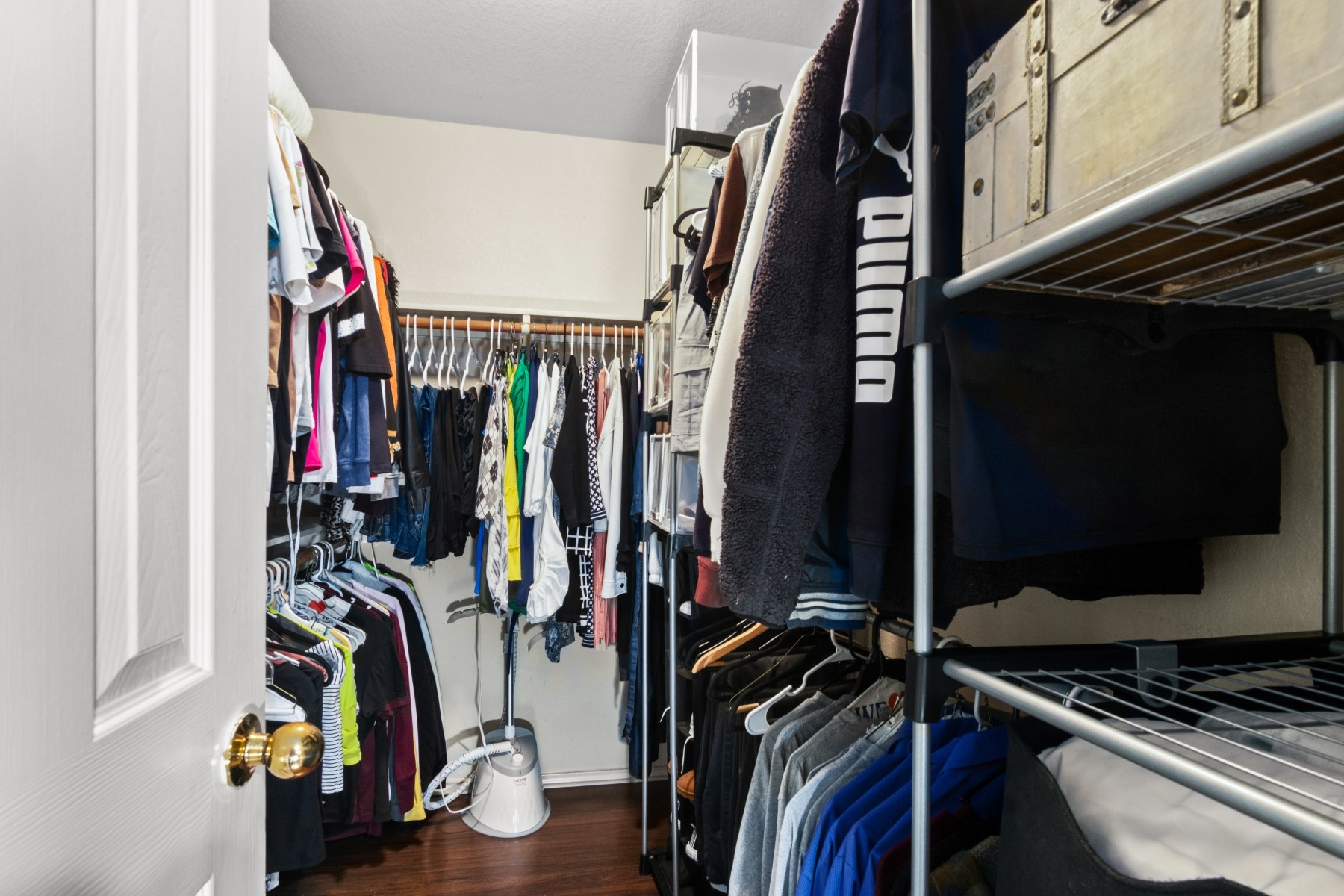 18823 Appletree Ridge Road Houston, TX 77084 - Photo 12 of 22 a view of walk in closet with clothes