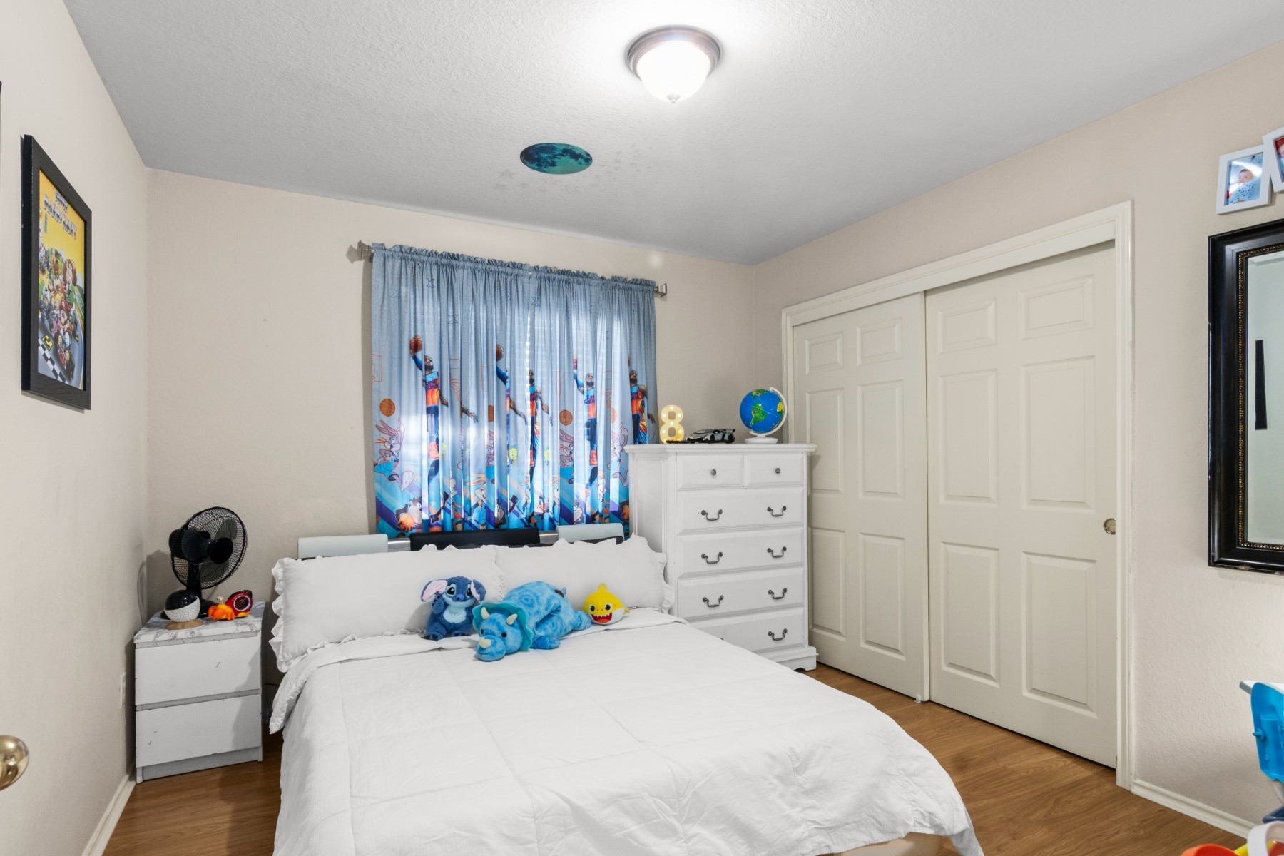 18823 Appletree Ridge Road Houston, TX 77084 - Photo 18 of 22 a bedroom with a bed and cabinets
