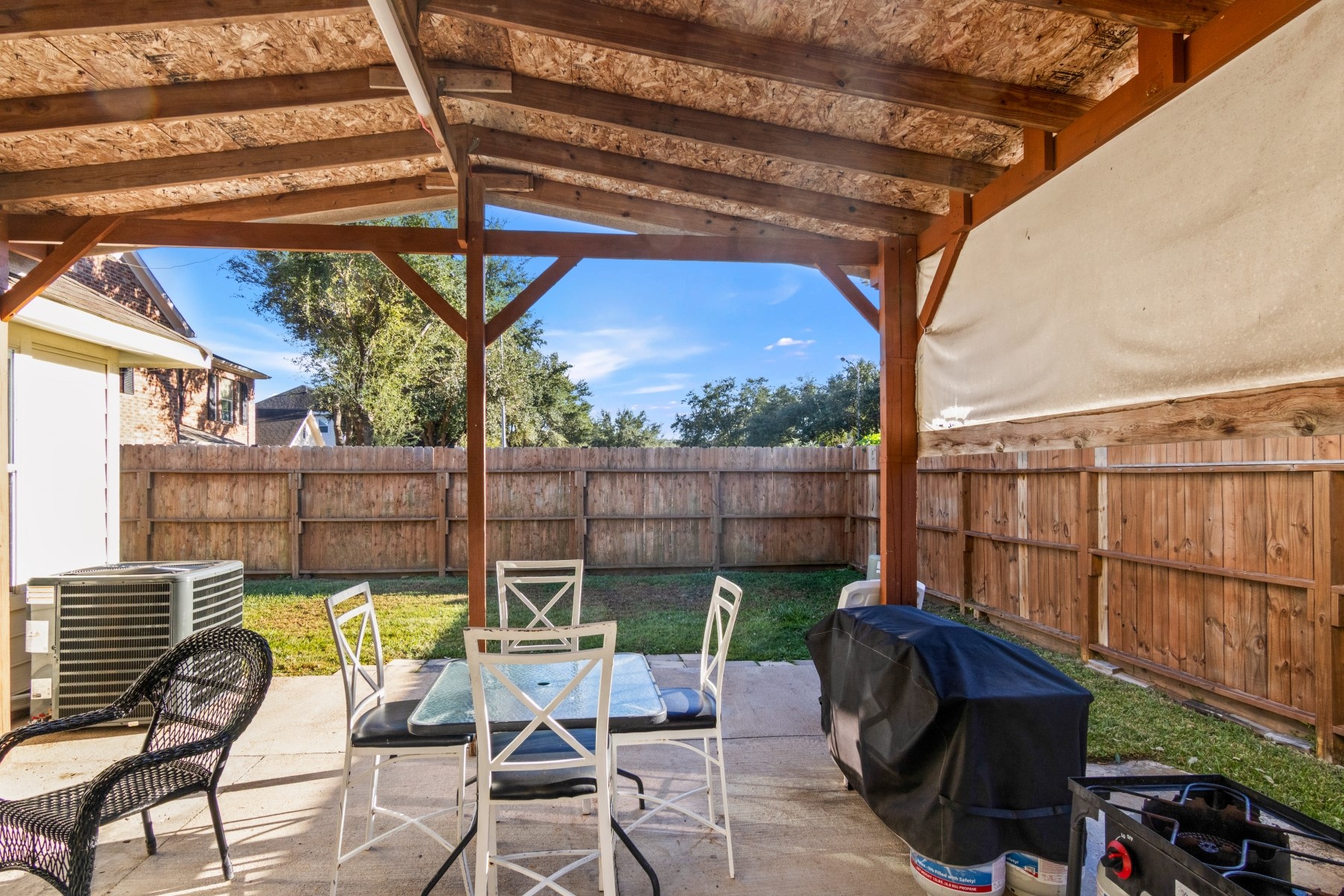 18823 Appletree Ridge Road Houston, TX 77084 - Photo 20 of 22 a view of a chair and tables in the patio