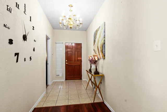 a view of a hallway with a white walls
