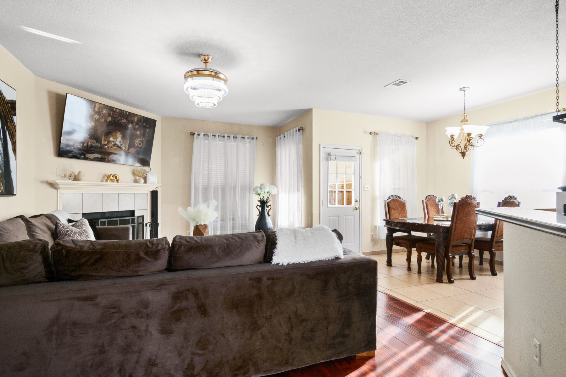18823 Appletree Ridge Road Houston, TX 77084 - Photo 5 of 22 a living room with fireplace furniture and a chandelier