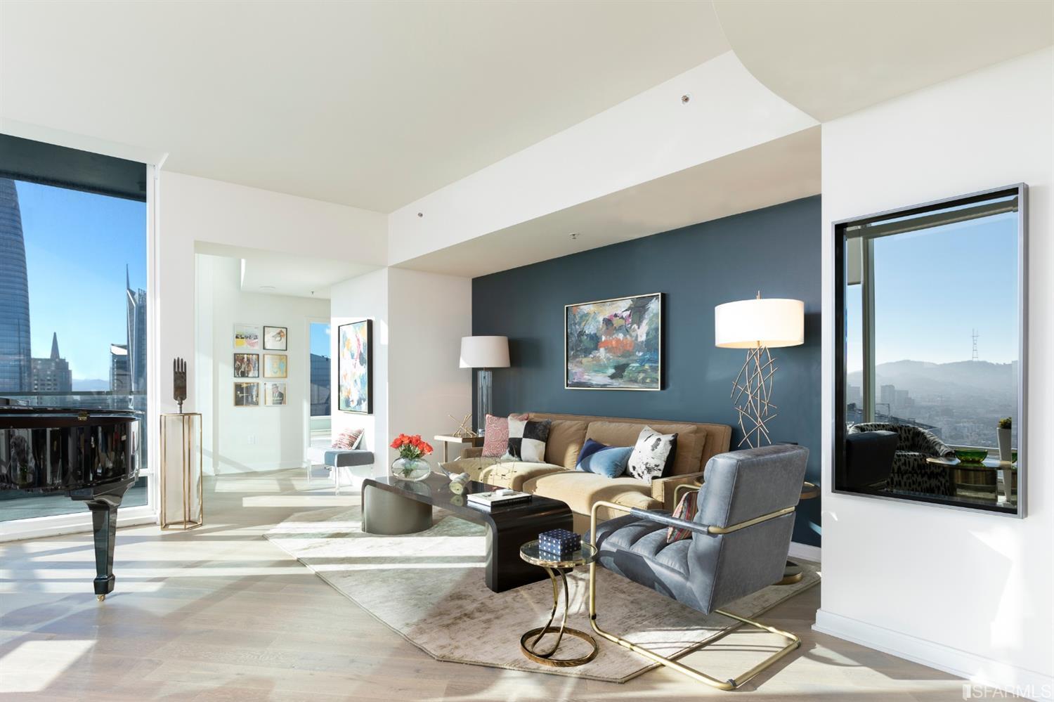 401 Harrison Street, Unit PH49A San Francisco, CA 94105 - Photo 2 of 14 a living room with furniture and a mirror