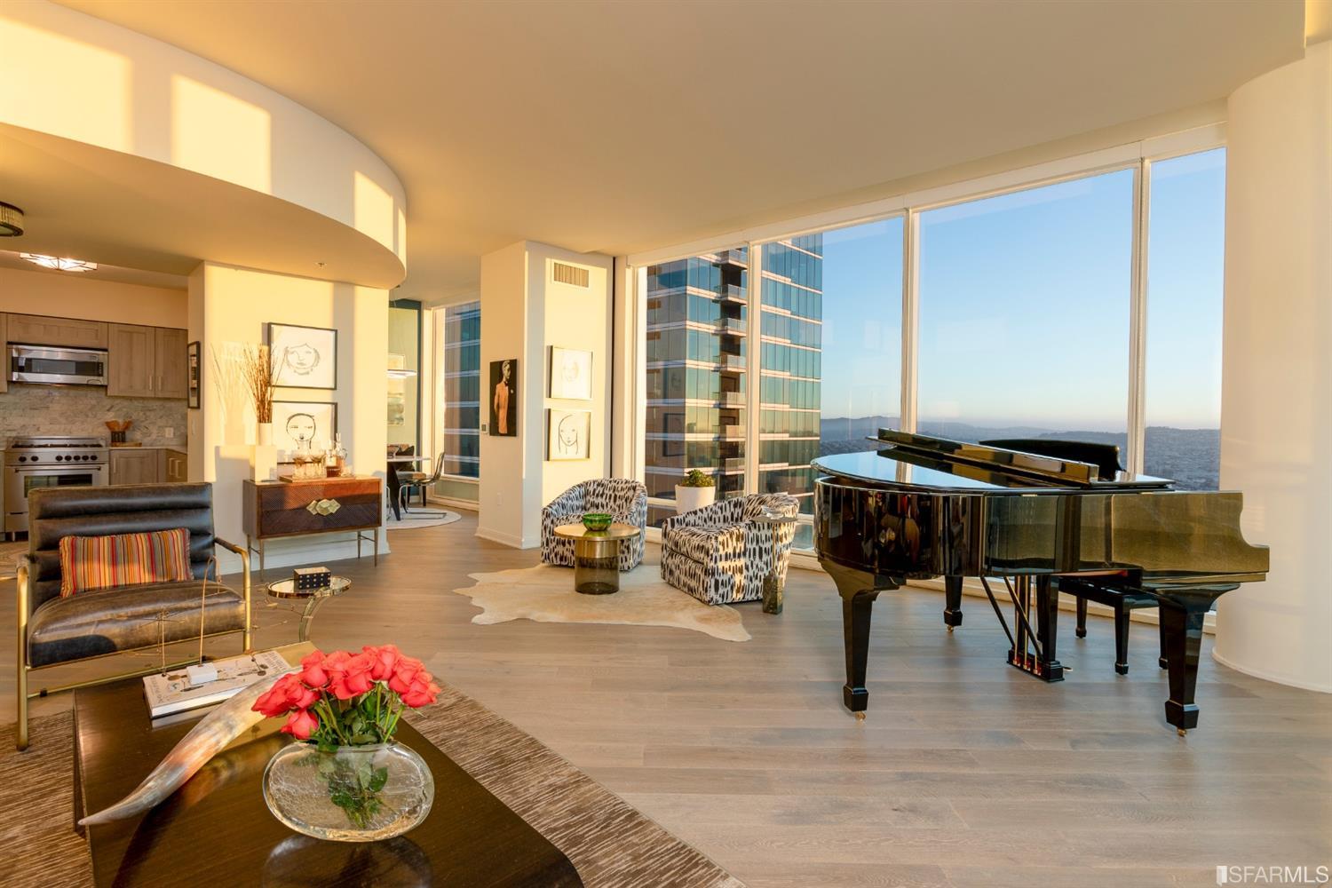 401 Harrison Street, Unit PH49A San Francisco, CA 94105 - Photo 14 of 14 a living room with furniture and a floor to ceiling window