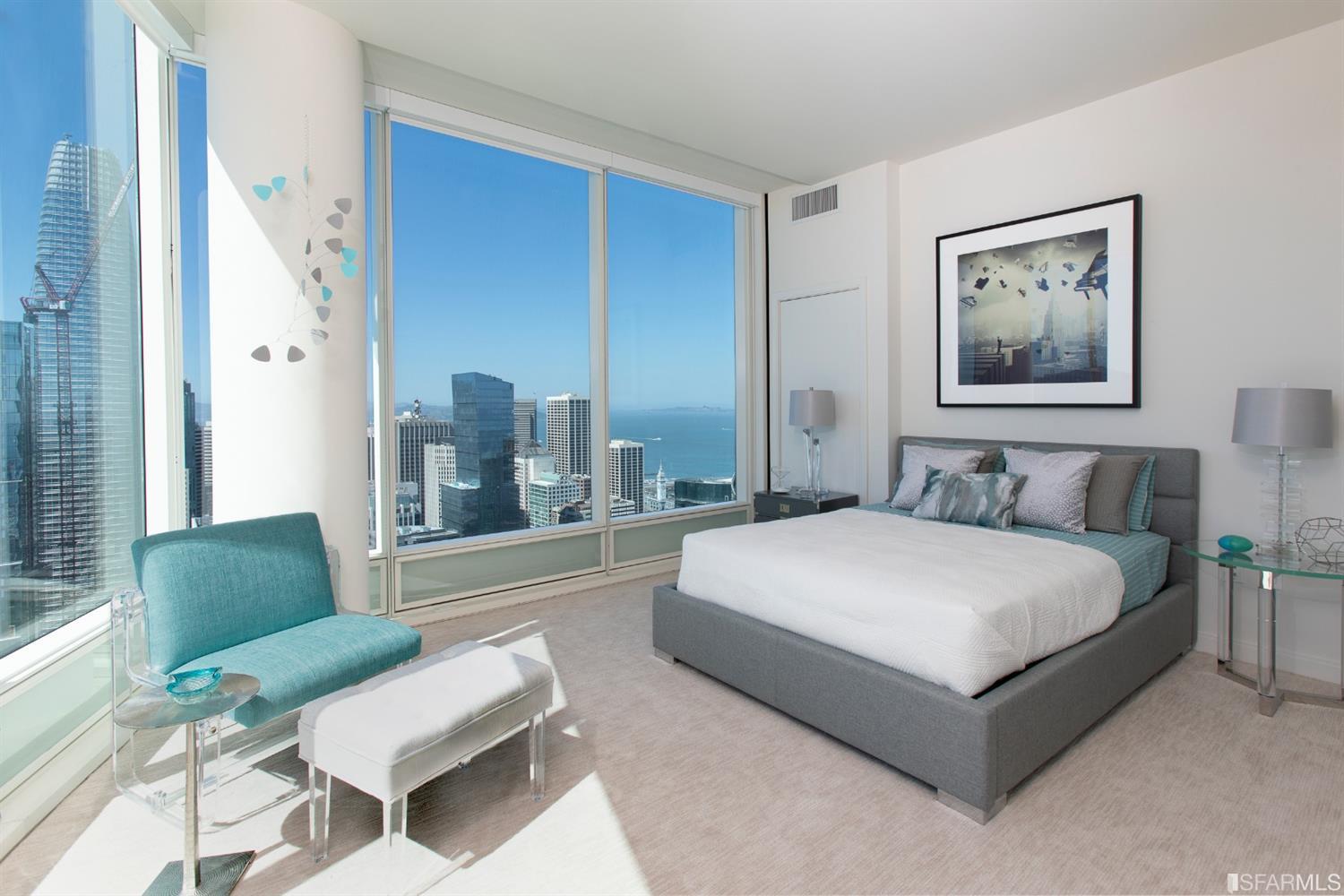 401 Harrison Street, Unit PH49A San Francisco, CA 94105 - Photo 4 of 14 a spacious bedroom with a bed and glass window