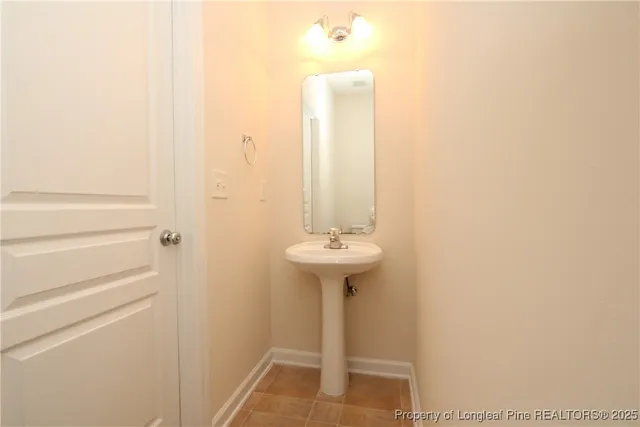 a bathroom with a sink a mirror and a shower