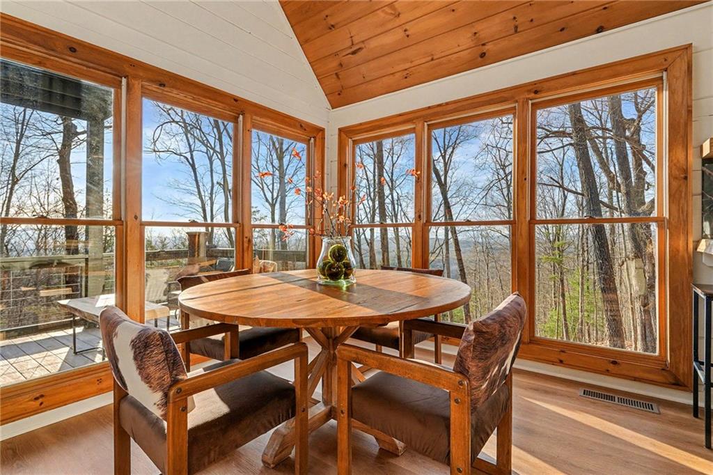 Undisclosed Address Morganton, GA 30560 - Photo 11 of 45 a dining room with furniture window and wooden floor
