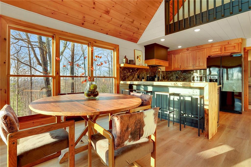 Undisclosed Address Morganton, GA 30560 - Photo 12 of 45 a dining room with a table and chairs
