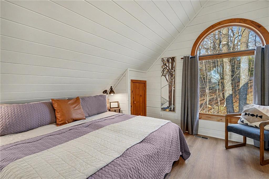 Undisclosed Address Morganton, GA 30560 - Photo 16 of 45 a bedroom with a large bed and a window