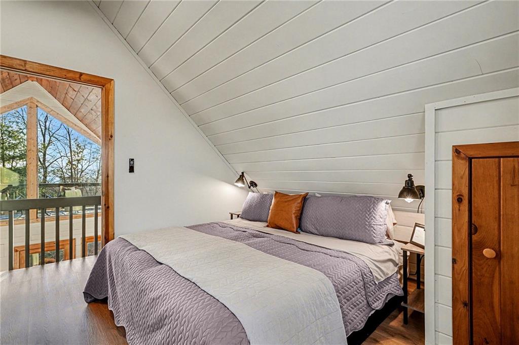 Undisclosed Address Morganton, GA 30560 - Photo 17 of 45 a bedroom with a large bed and a large window