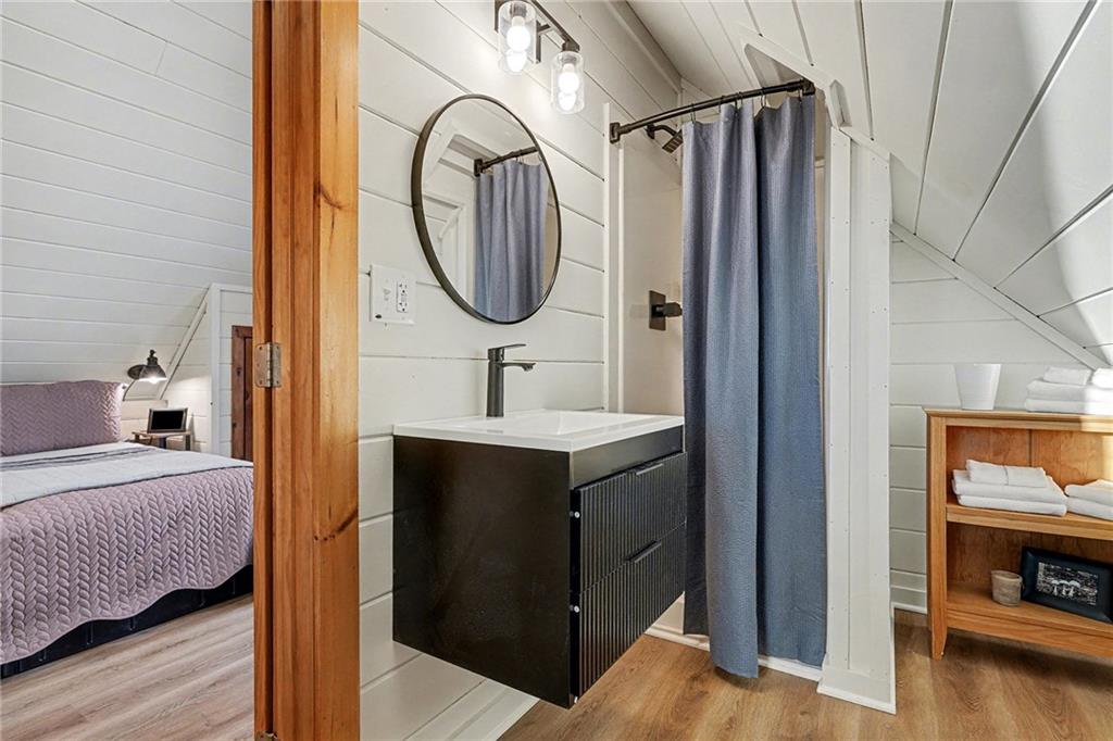 Undisclosed Address Morganton, GA 30560 - Photo 18 of 45 a en suite bathroom with a sink and a mirror