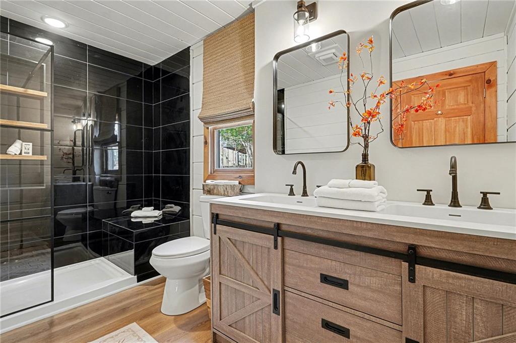 Undisclosed Address Morganton, GA 30560 - Photo 19 of 45 a bathroom with a sink a toilet and shower