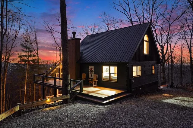a view of balcony with wooden floor and fence