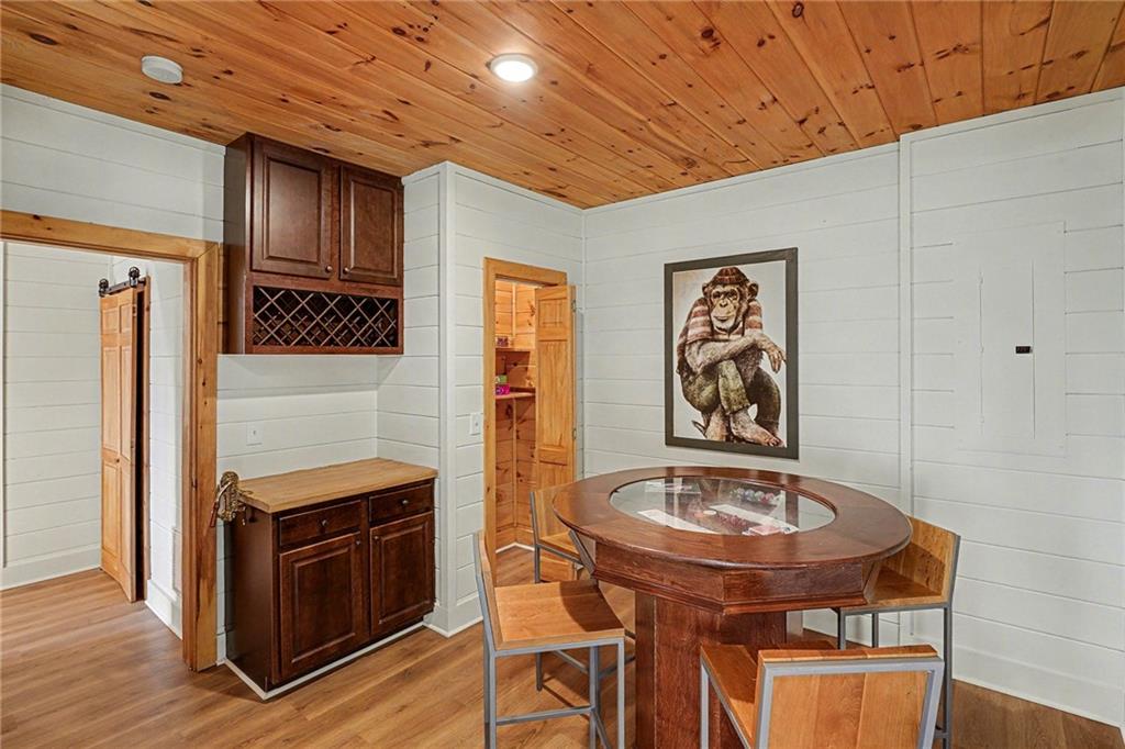 Undisclosed Address Morganton, GA 30560 - Photo 23 of 45 a view of a dining room with furniture and wooden floor