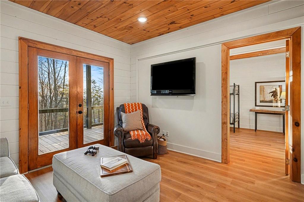 Undisclosed Address Morganton, GA 30560 - Photo 29 of 45 a living room with furniture and a flat screen tv