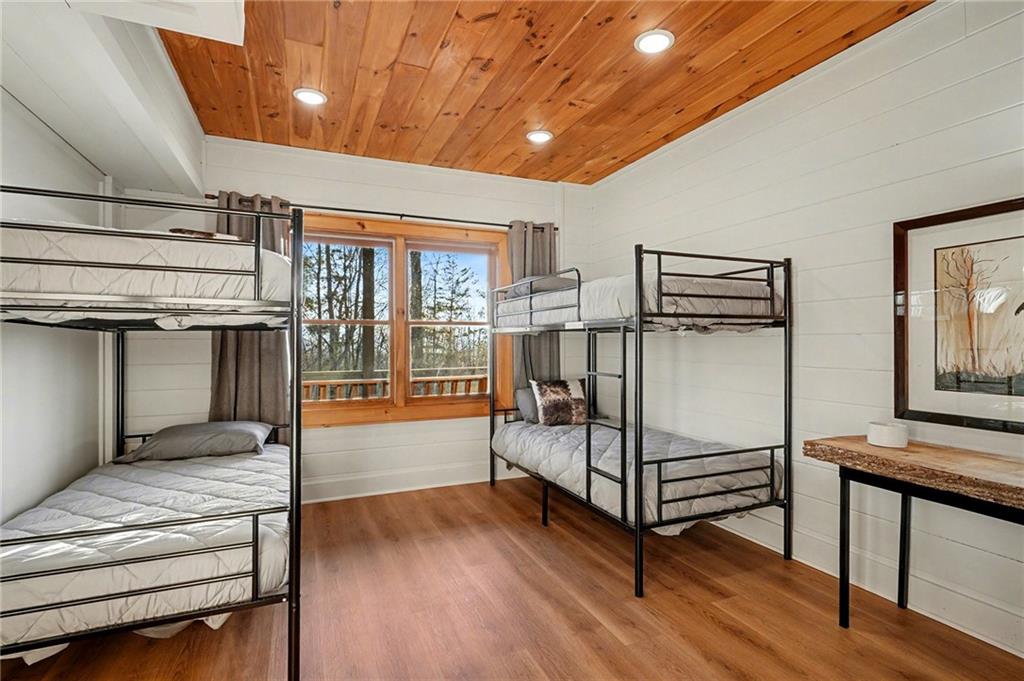 Undisclosed Address Morganton, GA 30560 - Photo 31 of 45 a bedroom with furniture and wooden floor