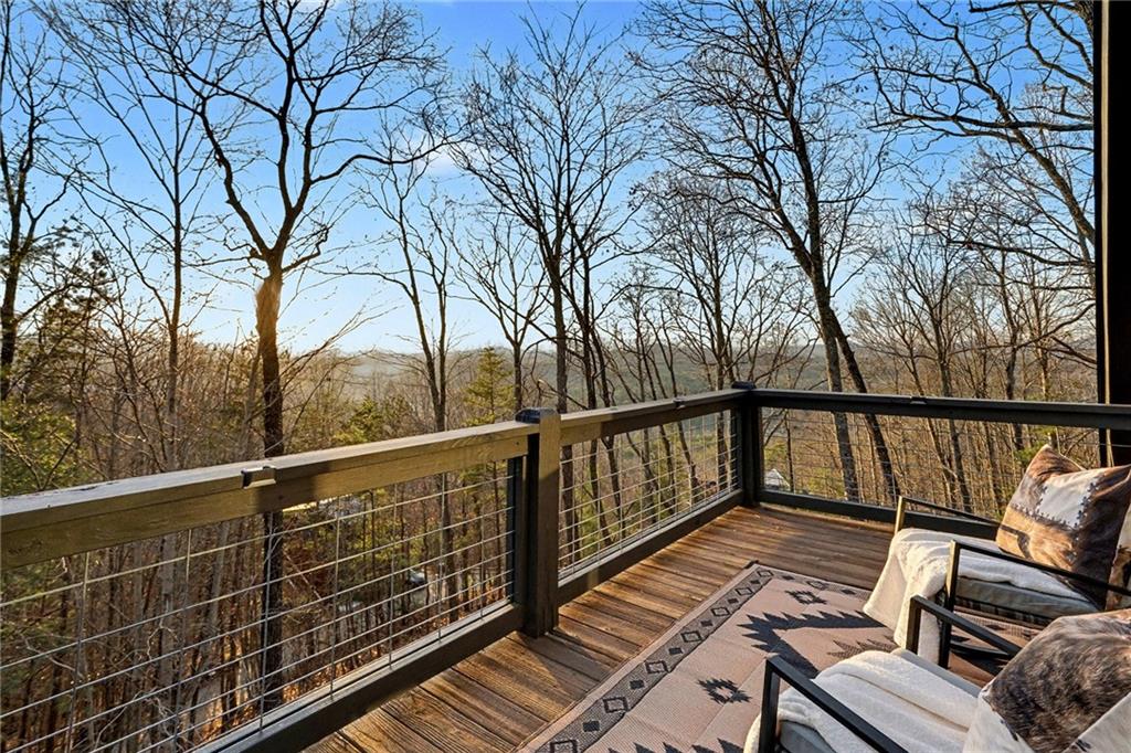 Undisclosed Address Morganton, GA 30560 - Photo 36 of 45 a view of balcony with wooden floor and fence and trees