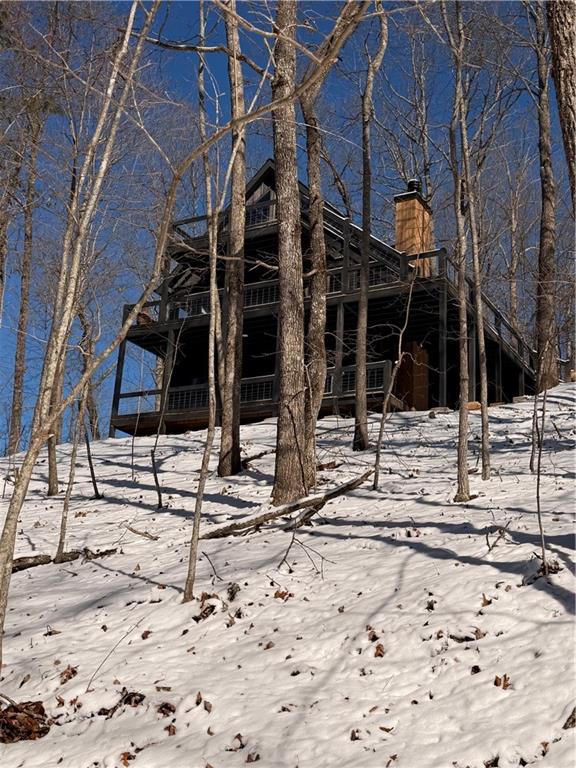Undisclosed Address Morganton, GA 30560 - Photo 45 of 45 a view of a house with snow on the background