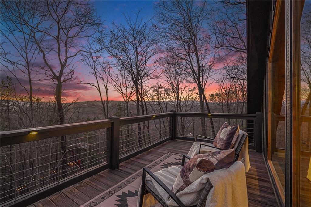 Undisclosed Address Morganton, GA 30560 - Photo 5 of 45 a view of balcony with wooden floor and fence