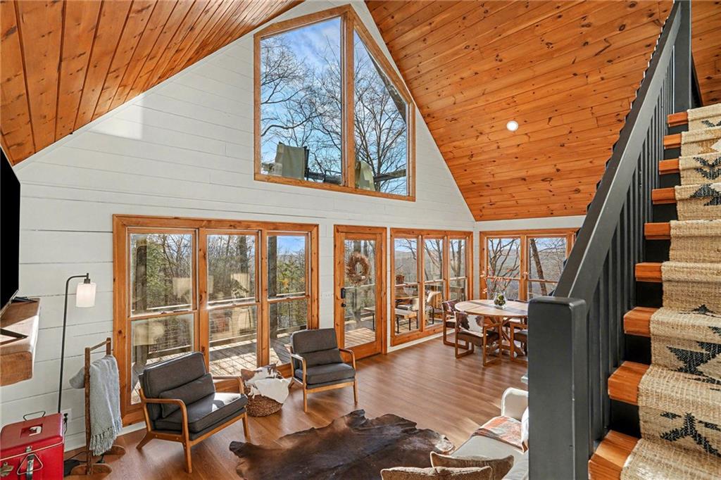 Undisclosed Address Morganton, GA 30560 - Photo 10 of 45 a living room with furniture floor to ceiling windows and floor to ceiling window