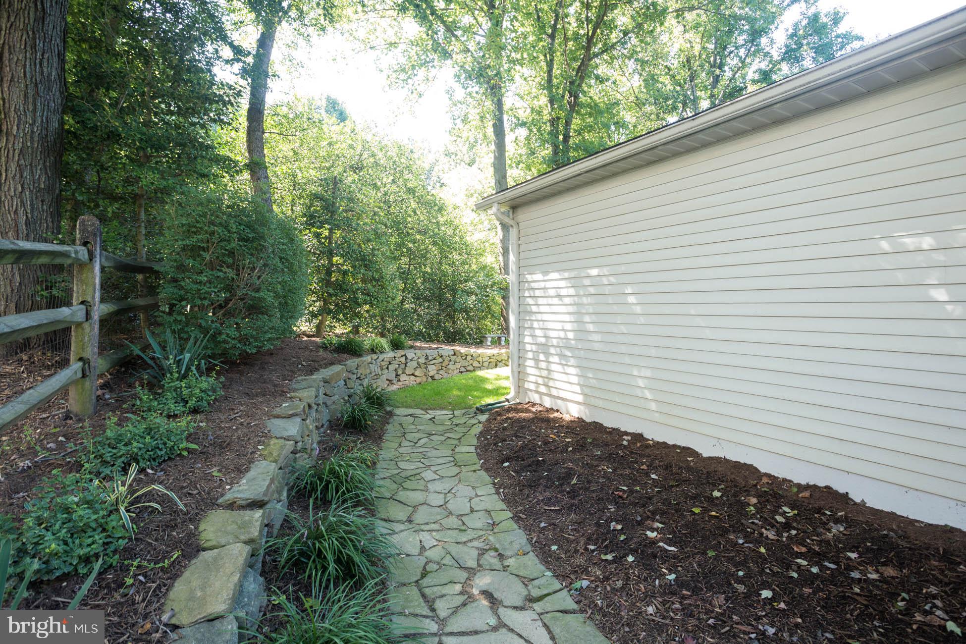 1325 Quail Ridge Drive Reston, VA 20194 - Photo 25 of 27 Stone pathway near large 4' addition to garage.