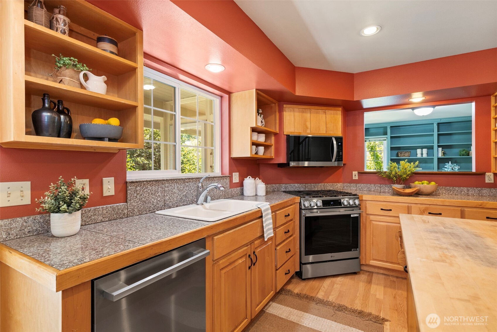 1757 Maple Street Port Townsend, WA 98368 - Photo 10 of 40 a kitchen with stainless steel appliances granite countertop a sink and stove