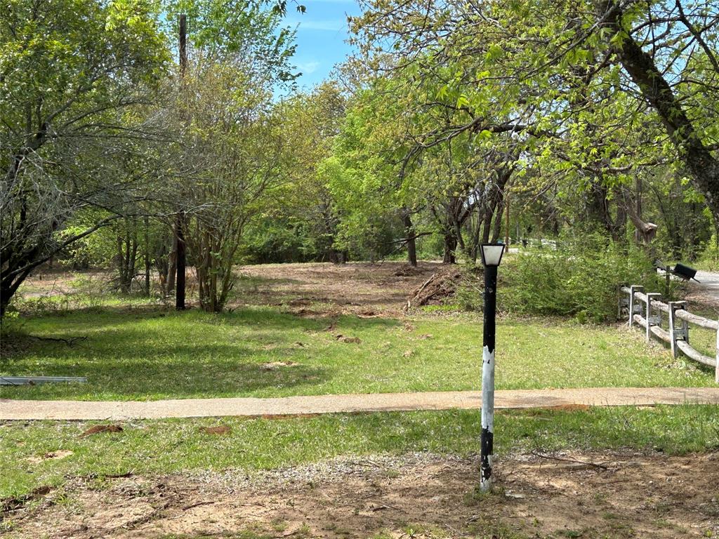 2112 Peterson Road Denison, TX 75021 - Photo 3 of 9 a backyard of a house with lots of green space
