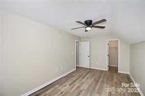 6109 Bunn Simpson Road Marshville, NC 28103 - Photo 11 of 17 a view of a room with a ceiling fan and a hardwood floor