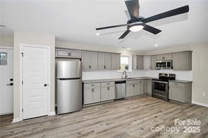 6109 Bunn Simpson Road Marshville, NC 28103 - Photo 4 of 17 a kitchen with a refrigerator cabinets and wooden floor