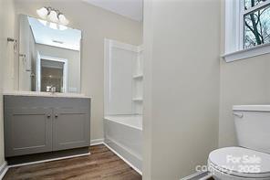 6109 Bunn Simpson Road Marshville, NC 28103 - Photo 10 of 17 a white toilet sitting next to a bathroom sink
