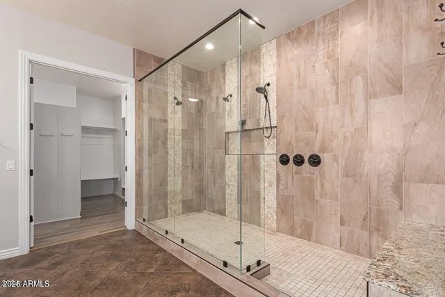 a bathroom with a shower and a sink